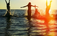 Playing in sunset sea